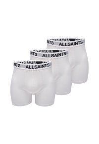 Trois paires de boxers blancs avec une ceinture logo noire. Le tissu est lisse et extensible, offrant un ajustement serré et des coutures renforcées.