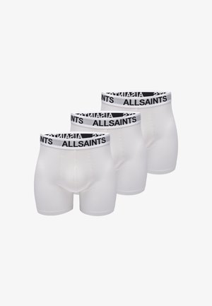 Drie paren witte boxershorts met een zwarte logo-elastic band. De stof is soepel en rekbaar, met een nauwsluitende pasvorm en verstevigde naden.