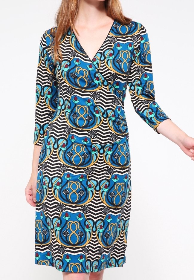 Wrap dress featuring a v-neckline, three-quarter sleeves, and a pattern of blue and gold swirls on a black and white striped background.