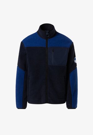 Navy and blue fleece jacket with zip front, high collar, chest pocket, and soft texture. Features large blue panels on the shoulders and arms.