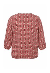 Rote und cremefarbene Bluse mit geometrischem Diamantmuster, lockere Passform, lange Ärmel und elastischem Saum. Weicher Stoff mit glatter Textur.