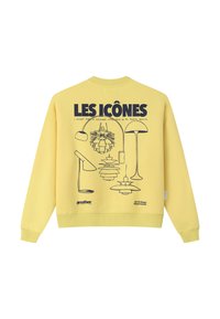Sweat-shirt jaune avec des dessins au trait noirs de cinq lampes modernes et le texte "LES ICÔNES" en caractères gras en haut.
