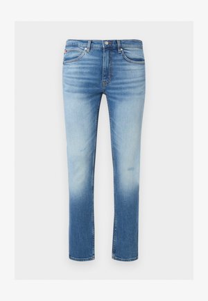 Jean slim bleu homme avec face avant délavée, design classique cinq poches, fermeture par boutons et passants de ceinture.