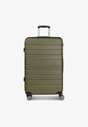 Valigia rigida verde oliva con scanalature verticali, logo sul davanti, manico telescopico e ruote girevoli per una facile mobilità.