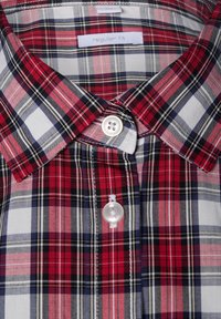 Red and blue plaid button-up shirt with a regular fit, featuring a classic collar and two white buttons on the front.