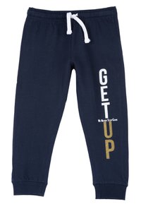Mörkblå joggerbyxor i mjuk bomull, med resårmidja och vit dragsko samt tryckt text och dekorativa detaljer.