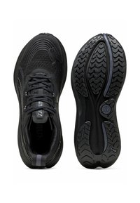 Black athletic shoes with a textured mesh upper, reinforced laces, and a flexible rubber outsole featuring a patterned tread for traction.