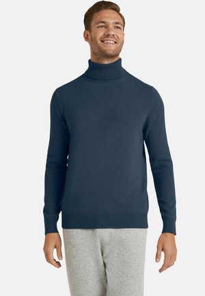 Granatowy golf wykonany z miękkiej dzianiny. Posiada długie rękawy, ściągacze przy mankietach i u dołu oraz dopasowany krój.