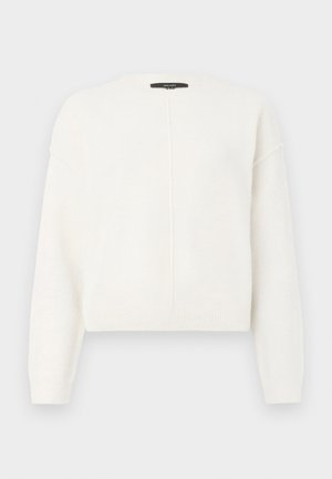 Kratka bela pulover iz mehkega materiala z okroglo ovratnikom, z padajočimi ramenskimi šivi in vertikalnim šivom na sprednji strani.