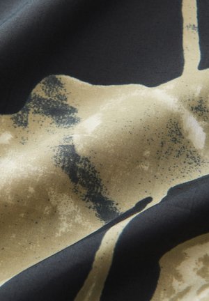 Textile fabric featuring a black base with abstract gold and beige patterns. Soft texture with uneven surface and faint speckles.