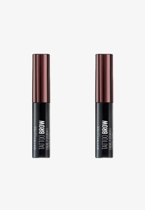 Deux tubes de mascara noirs avec une base noire brillante et des bouchons métalliques brun rougeâtre. Les étiquettes indiquent "Tattoo Brow" en blanc.