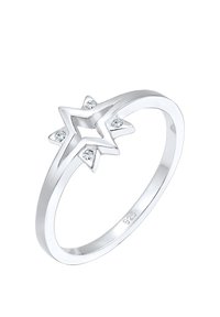 Sølvring i sterlingsølv med en stjerneform og fire små klare sten indsat i en poleret ring. Glat tekstur og minimalistisk design.