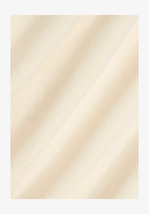 Tessuto beige chiaro con texture, caratterizzato da un motivo a coste, con linee diagonali sottili e un aspetto morbido e intrecciato.