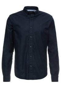 Ciemnoniebieska koszula na guziki z bawełny, z kołnierzykiem, długimi rękawami i małym haftowanym logo na piersi.