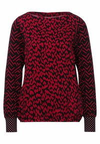 Långärmad topp med röd och svart mönstring, med leopardmönstrad kropp och geometriskt mönstrade ärmar med elastiska ärmslut.