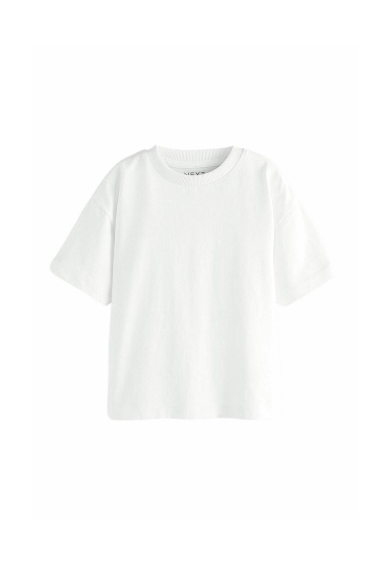 Camiseta de algodón blanca con cuello redondo y mangas cortas, que presenta un corte holgado y una textura suave. Sin patrones ni acentos visibles.