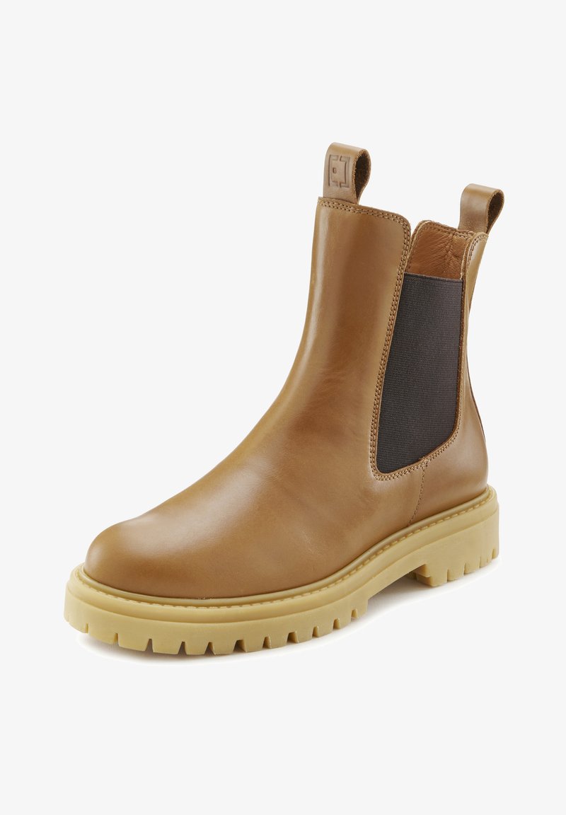 Braune Leder Chelsea-Stiefel mit elastischen seitlichen Einsätzen, strukturierten Oberflächen und einer klobigen gelben Sohle mit geriffeltem Muster.
