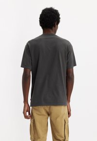 Levi's® BUTTON HENLEY - Základné tričko - black oyster