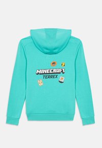 Türkiser Hoodie mit Minecraft Terrex Logo und vier Spiel-Patches im Pixel-Stil auf der Rückseite, flach ausgelegt mit hochgestellter Kapuze.
