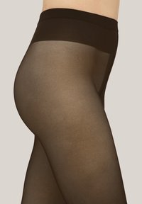 Schwarze transparente Strumpfhose mit glatter Textur, ausgestattet mit einem breiten undurchsichtigen Bund und einem durchscheinenden Finish, das einen dezenten Glanz hervorhebt.