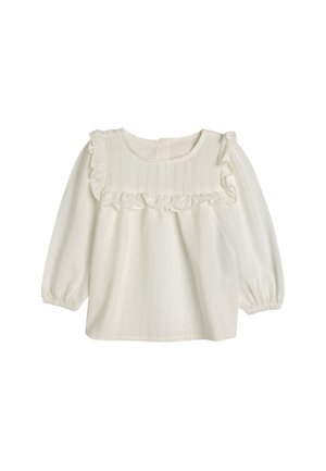 Blusa bianca a maniche lunghe con scollatura arricciata, righe sottili testurizzate, tessuto morbido e polsini elasticizzati. Chiusura con bottoni sul retro.