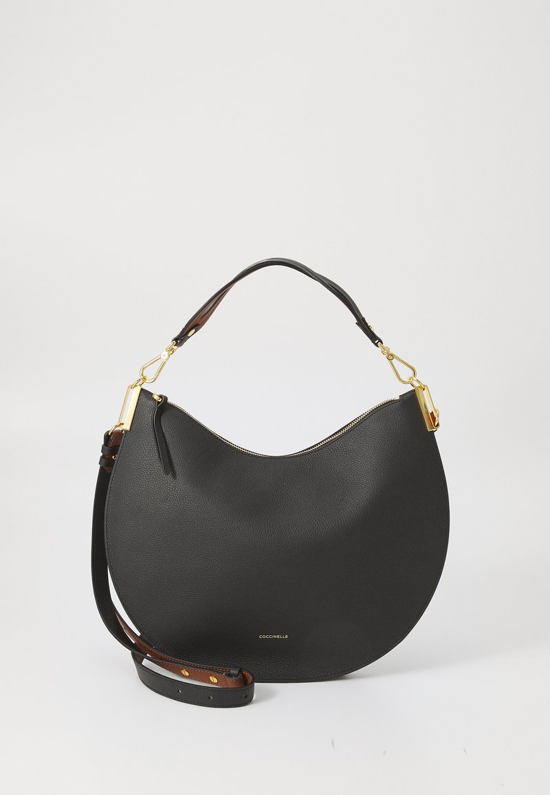 Black leather handbag with a curved shape, gold hardware accents, and a detachable strap. Features a zipper closure and embossed logo.