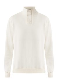 Sudadera de color crema con un cuello alto, mangas largas y puños acanalados. Confeccionada en un tejido suave, cuenta con un detalle de cremallera de un cuarto.