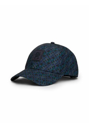 Dark blue baseball cap with green and yellow geometric pattern and a black embossed square logo on the front panel.