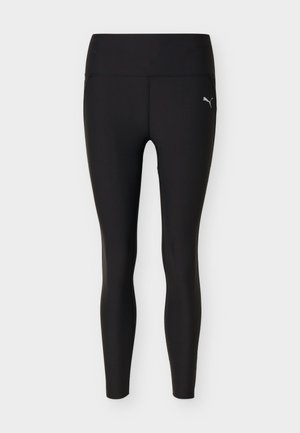 Črne pajkice Puma z visokim pasom in polno dolžino, z majhnim belim logotipom Puma na zgornjem levem stegnu.