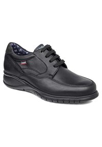 Zapato negro de cuero con cordones, punta redondeada, laterales texturizados, cuello acolchado y forro de tela con patrón. Suela de goma con agarre.