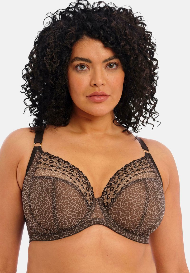 Bra in braunem Leopardenmuster mit transparentem Spitzenoverlay, Unterwichenstütze und verstellbaren Trägern mit goldfarbenen Akzenten. Strukturierte Details am Brustbereich.