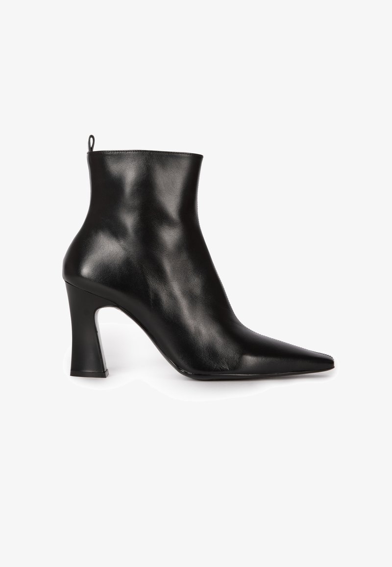 Black leather ankle boot with a pointed toe, smooth texture, and a chunky heel. Features a small loop at the back for easy wear.