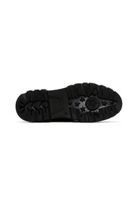 Suola di scarpa in gomma nera con motivi testurizzati, caratterizzata da una stella e numerosi accenti a forma di stella. Battistrada profondo per aderenza e trazione.