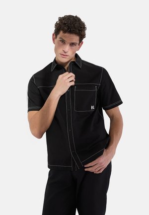 SHORT-SLEEVED CONTRAST STITCH - Pluus - black