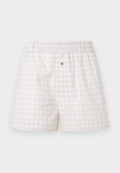 Ανδρικά μποξεράκια σε μπεζ και άσπρο καρό σχέδιο, με ελαστική ζώνη μέσης και δύο κουμπιά στο μπροστινό άνοιγμα.