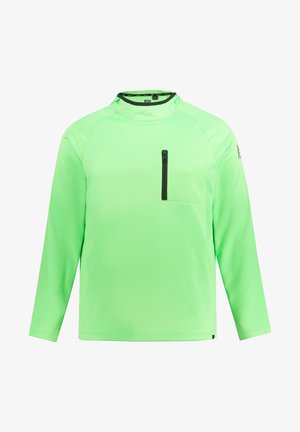 Langmouwige, heldergroene shirt gemaakt van soepele, lichte stof. Voorzien van een ritszak op de borst en een hoge kraagontwerp. Zwarte accenten.