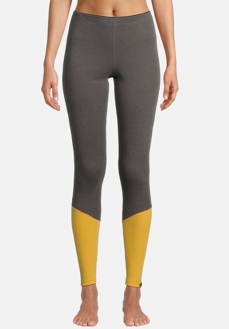 Graue Leggings mit einem gelben Akzent am Unterschenkel, aus einem dehnbaren Material hergestellt, mit einem figurbetonten Schnitt und einem bequemen Bund.