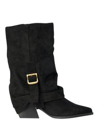 Black mid-calf suede boot with a slouchy design, side strap and gold buckle, pointed toe, and angled low stacked heel.