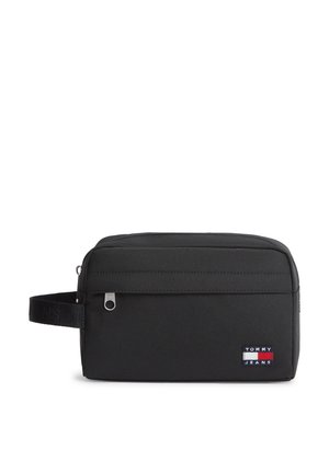 Fekete, téglalap alakú pipere táska elülső cipzáras zsebbel, oldalsó fogantyúval és Tommy Jeans logóval az elülső jobb alsó sarokban.