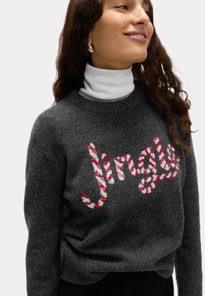 Gray wool sweater featuring the word "Jingle" in red and white sequin candy cane design. Pullover style with round neck and long sleeves.