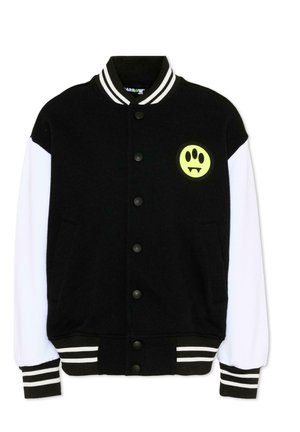 Czarno-biała kurtka typu varsity z zatrzaskami, paskowanym kołnierzem i mankietami oraz żółtą naszywką z buźką ze szczerbami na piersi.