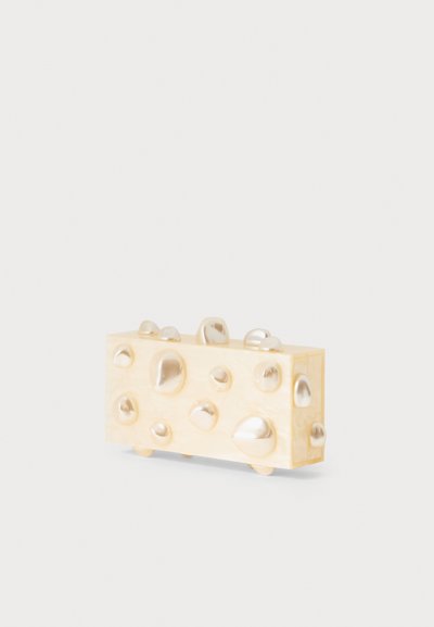 Bloc sculptural din material bej deschis, cu accente lucioase, bulbiforme, de dimensiuni variate, creând o suprafață texturată.