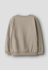 Beige crewneck sweatshirt met lange mouwen, ribgebreide manchetten en zoom. Gemaakt van een zachte katoenmix, met een gladde textuur.