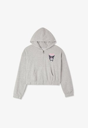 Felpa corta grigia chiara con zip, tasche frontali e logo del personaggio Kuromi in rosa e nero sul lato sinistro del petto.