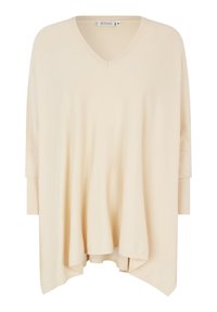 Top beige dal taglio morbido con scollatura a V, maniche a tre quarti e polsini a coste. Tessuto morbido e liscio con orlo leggermente curvo.