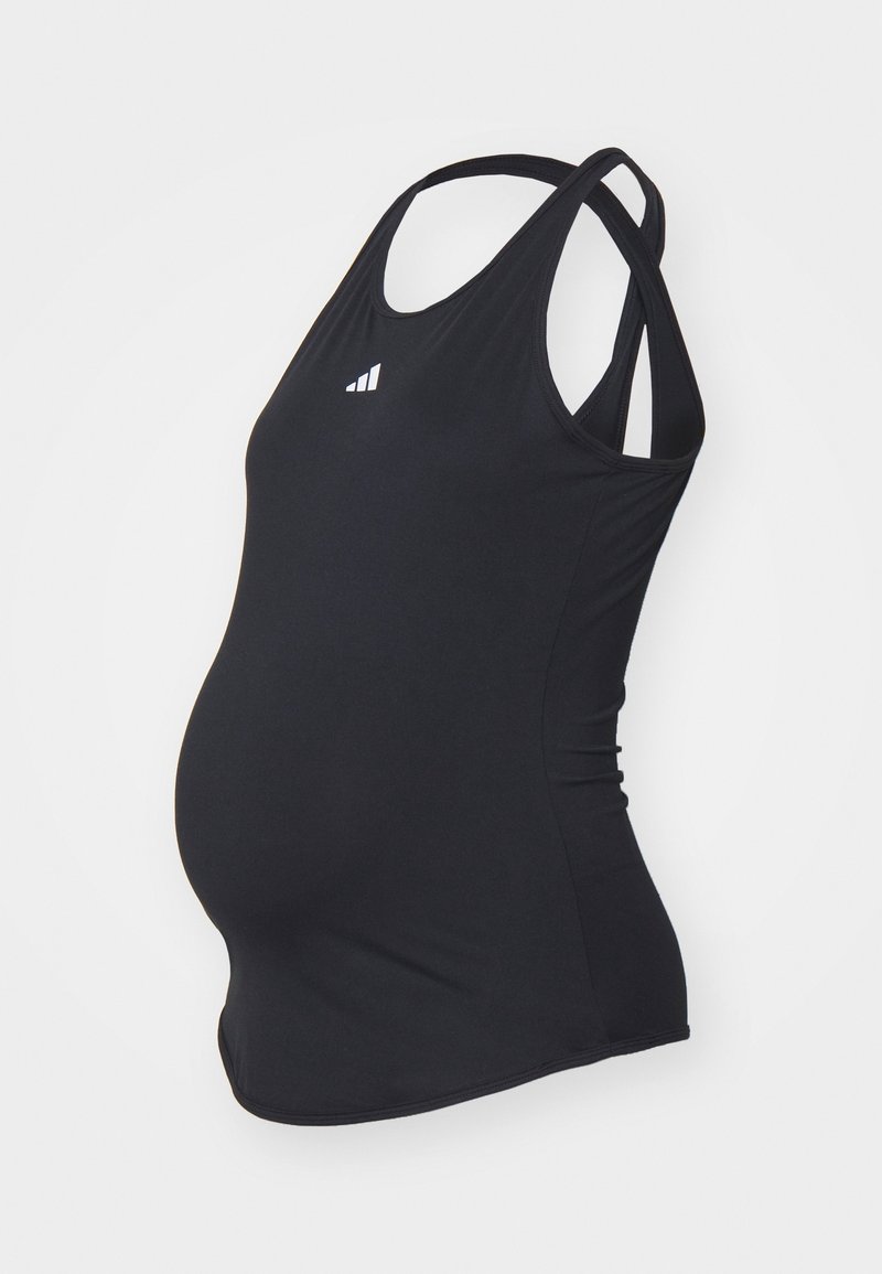 Top maternity nera con design aderente, spalline regolabili e logo sulla parte anteriore. Tessuto liscio e elastico si adatta alla crescente taglia.