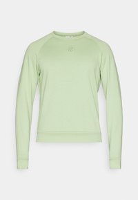 Sweat-shirt vert clair à manches longues avec col rond, petit logo rond centré sur la poitrine, poignets et ourlet côtelés.