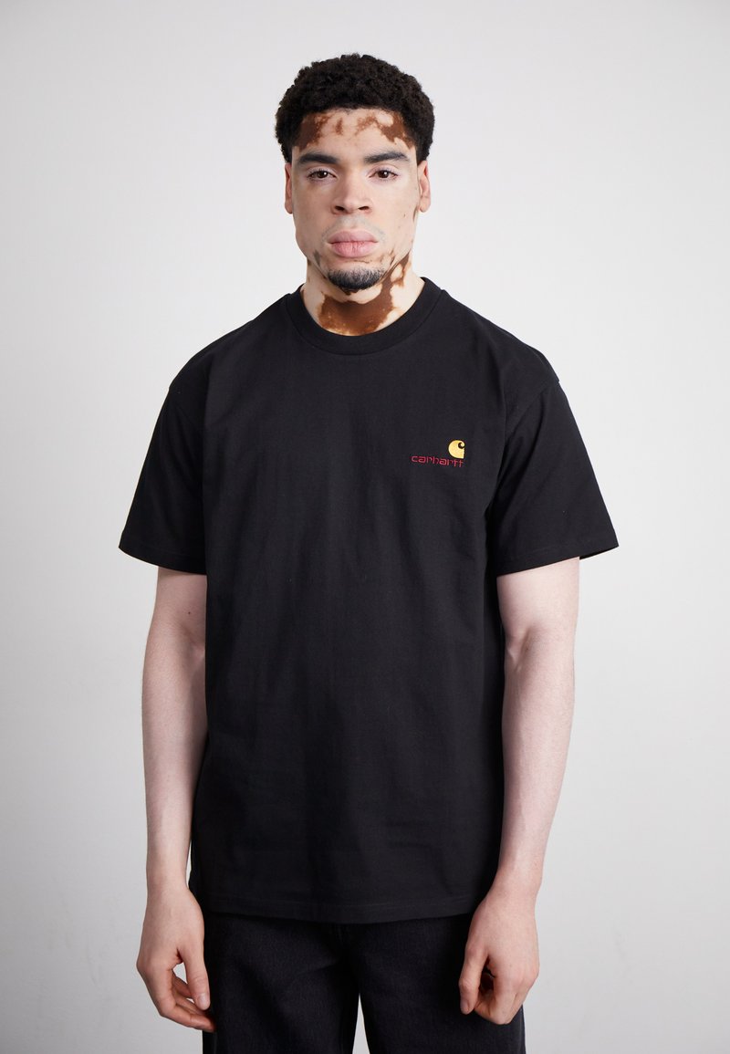 Black cotton t-shirt featuring a round neck and short sleeves, accented with a small yellow and red logo on the left chest.