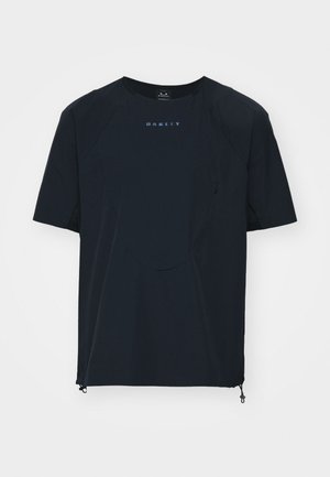 Dark navy short-sleeve t-shirt with a round neckline, subtle logo, rounded front hem, and adjustable side drawstrings. Lightweight fabric.