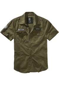 Chemise boutonnée à manches courtes de couleur vert olive avec deux poches poitrine, des épaulettes et trois écussons logo sur le devant et la manche.